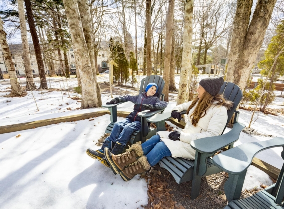 two people sitting on chairs enjoying Digby Pines 