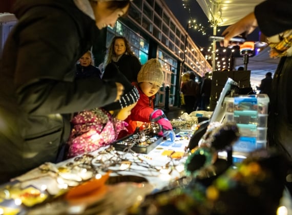 Family at Christmas market souvenir shop Uptown Sparkles