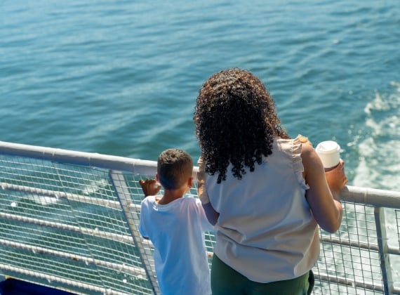 Family looking over the railing on the Ferry