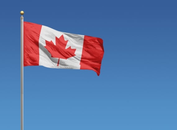 A Canadian flag blowing in the wind